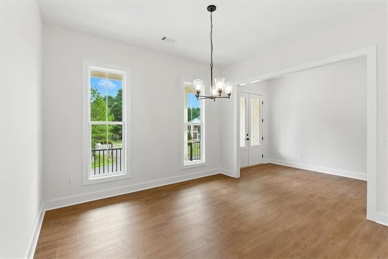 7 Rushden Way Southeast Rome, GA 30161 - Photo 18 of 53 a view of an empty room with window and wooden floor