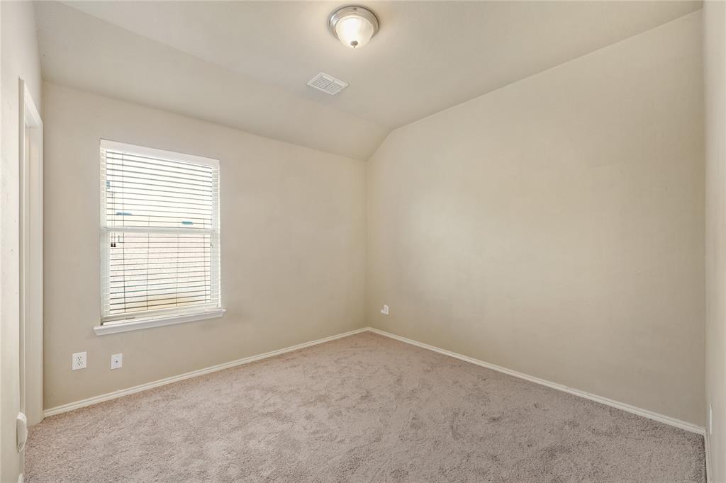 2003 Diamondback Forney, TX 75126 - Photo 20 of 30 Empty room with carpet floors and lofted ceiling