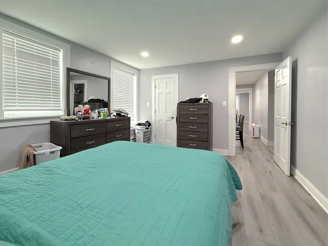 a bedroom with a bed and furniture