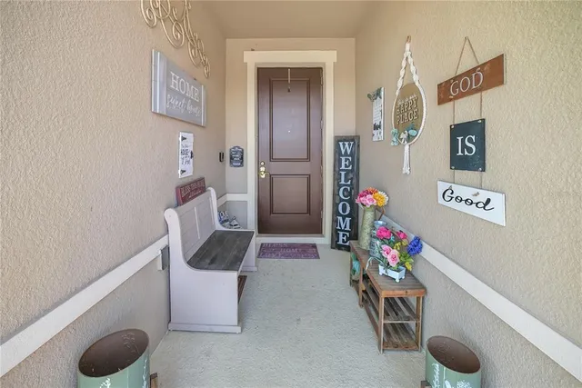 a hallway with toys and wooden floor