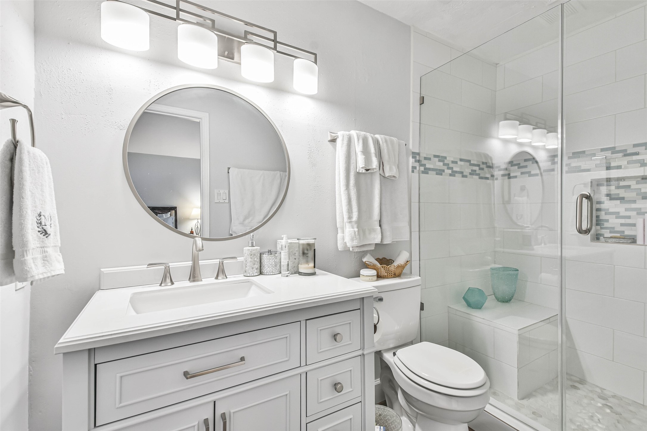 50 April Village Conroe, TX 77356 - Photo 12 of 19 a bathroom with a double vanity sink toilet and shower