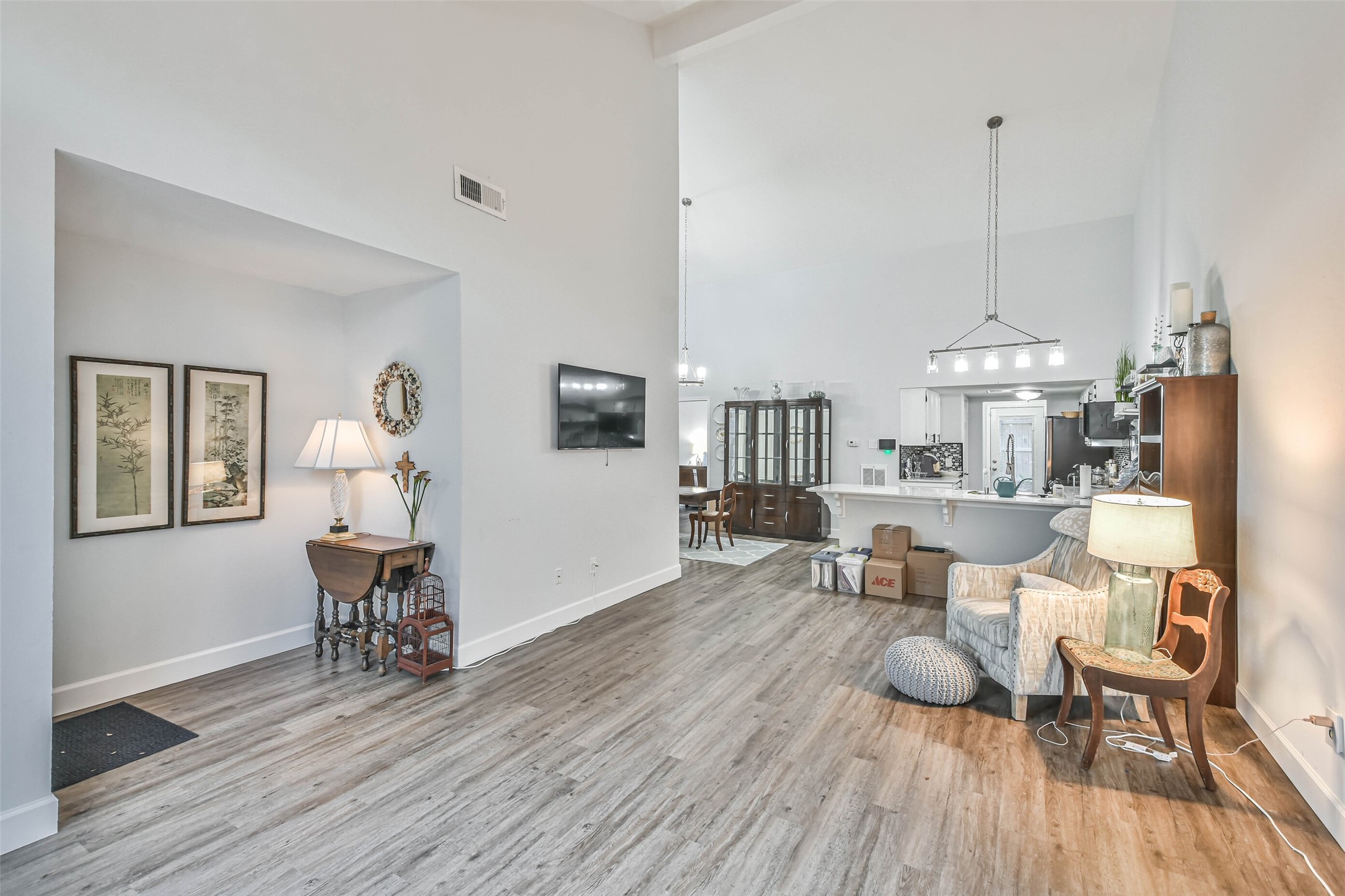 50 April Village Conroe, TX 77356 - Photo 4 of 19 a dining room with furniture a chandelier and wooden floor