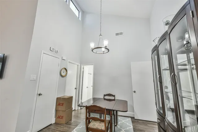 a view of a room with furniture and wooden floor