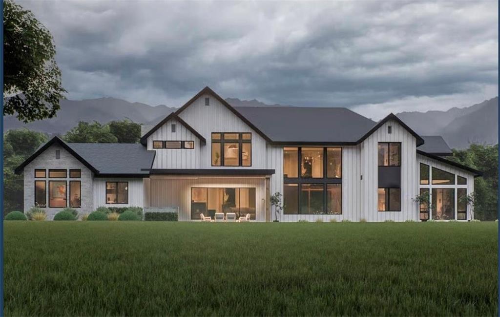 3430 Camp Branch Road Buford, GA 30519 - Photo 2 of 6 a front view of a house with a yard and garage