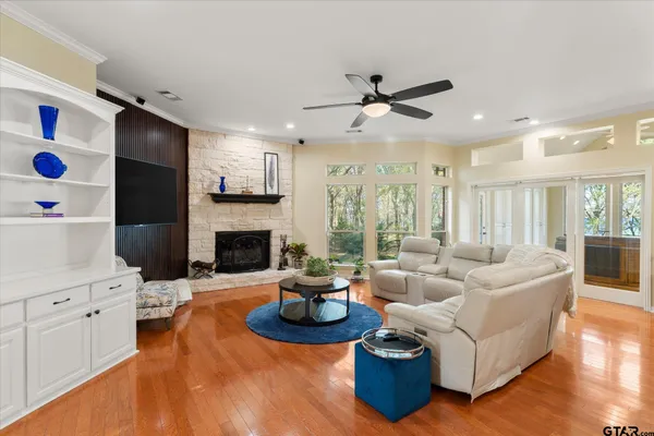 a living room with furniture and a fireplace