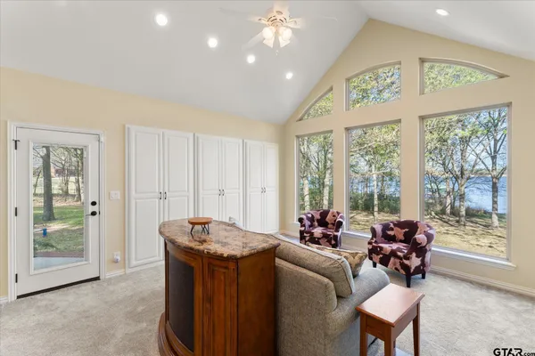 a living room with furniture and a large window