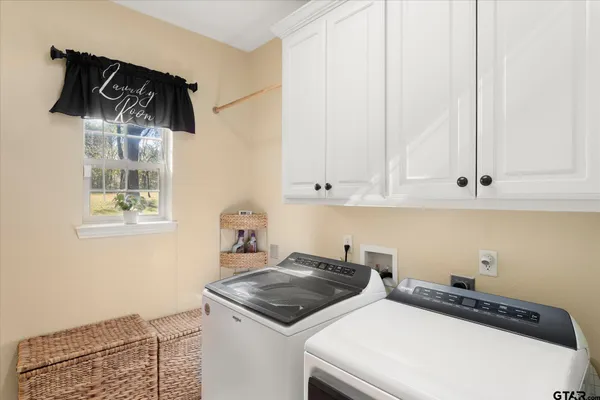 a kitchen with a stove and a white cabinet