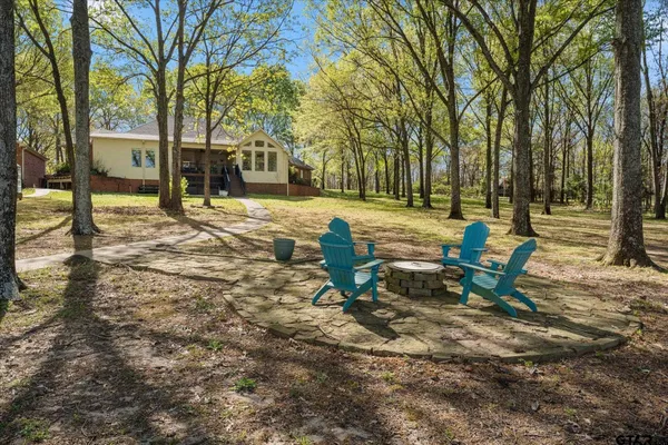 a view of a bench in a backyard