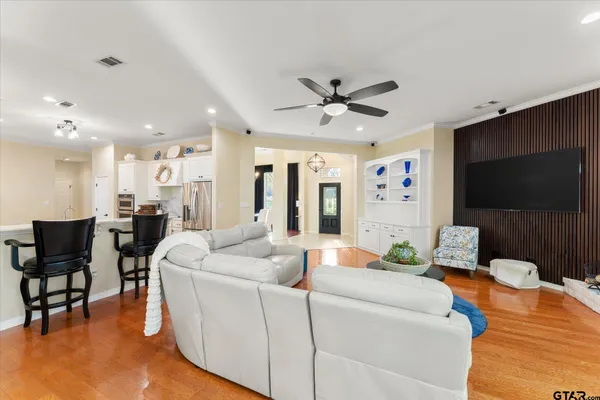 a living room with furniture and a flat screen tv