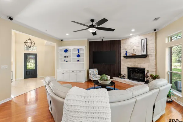 a living room with furniture and a fireplace