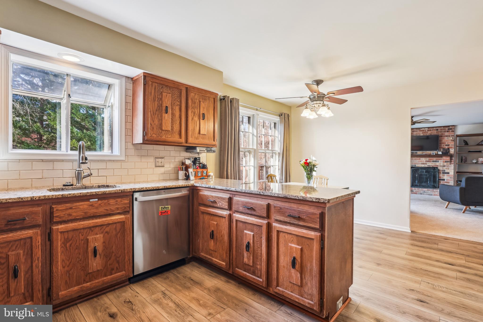 7122 Rolling Forest Avenue Springfield, VA 22152 - Photo 12 of 58 a kitchen with a sink cabinets and window