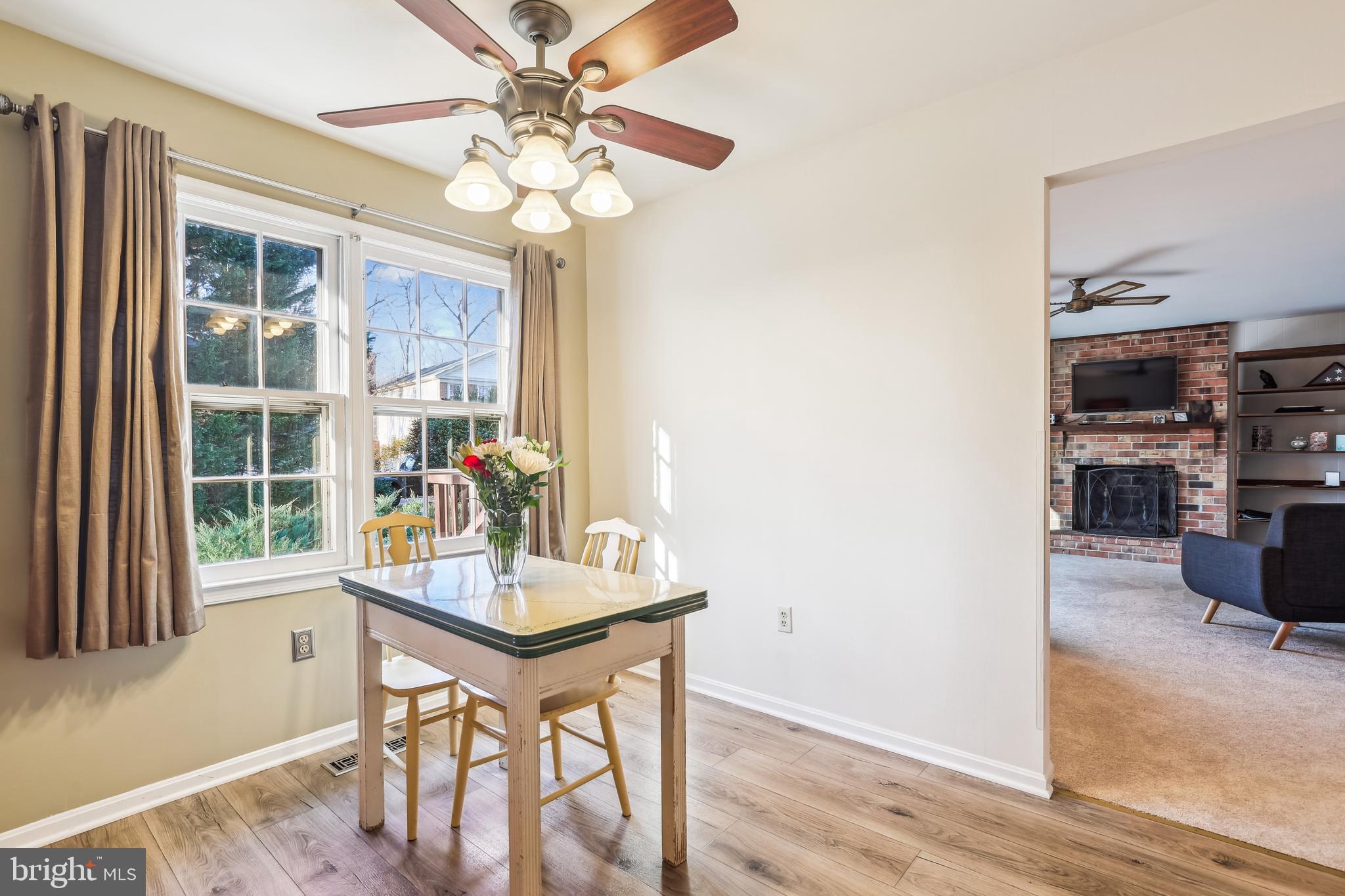 7122 Rolling Forest Avenue Springfield, VA 22152 - Photo 16 of 58 a view of a dining room with furniture window and outside view