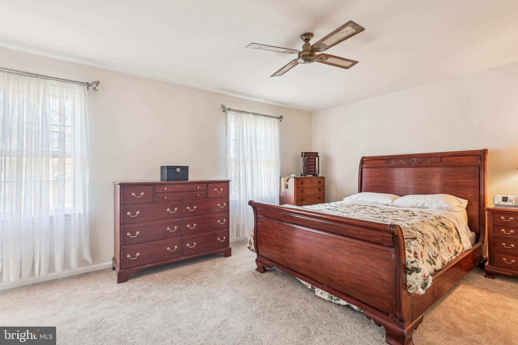 7122 Rolling Forest Avenue Springfield, VA 22152 - Photo 28 of 58 a bedroom with a bed and window