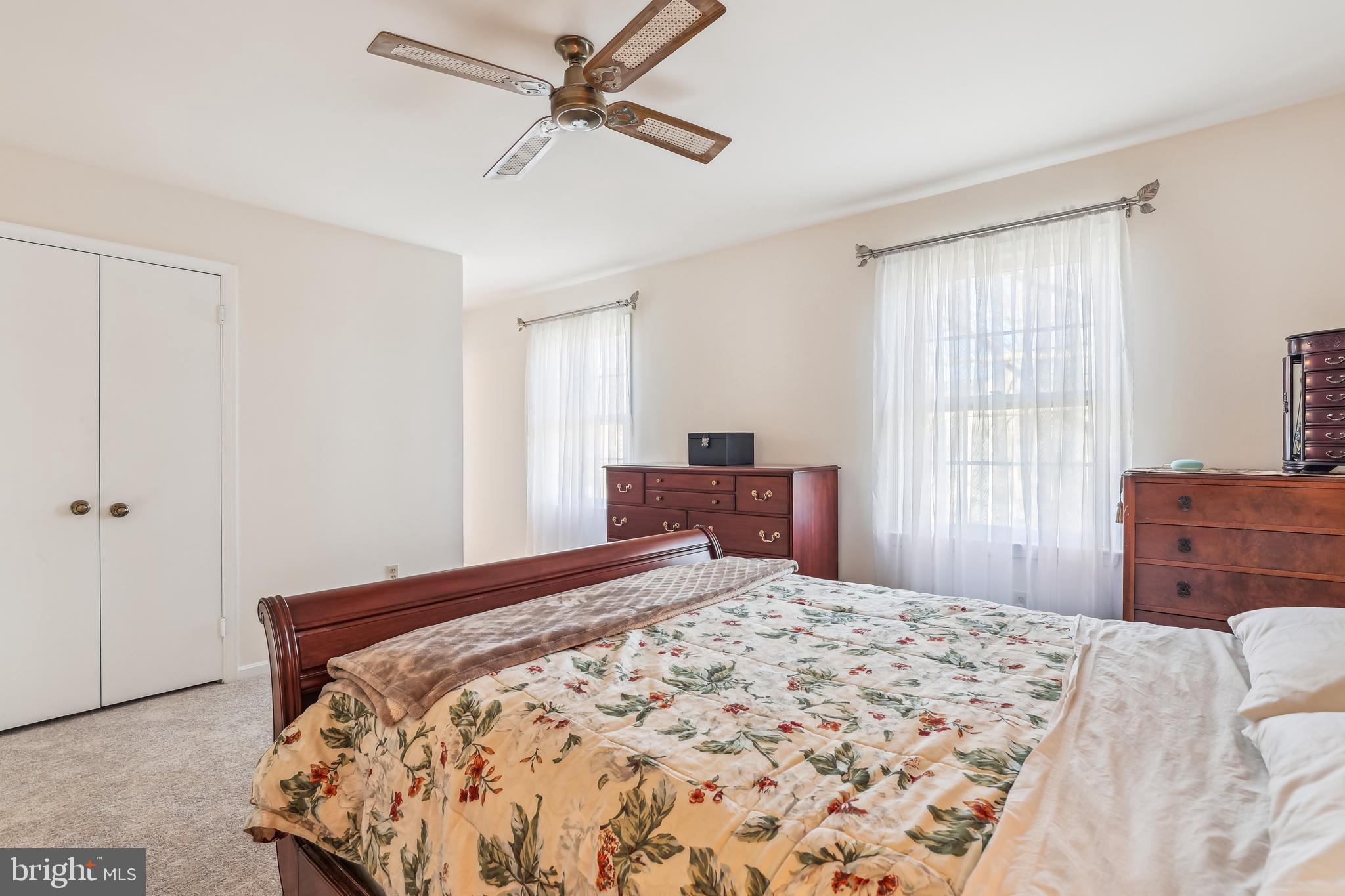 7122 Rolling Forest Avenue Springfield, VA 22152 - Photo 30 of 58 a bedroom with a large bed and a window