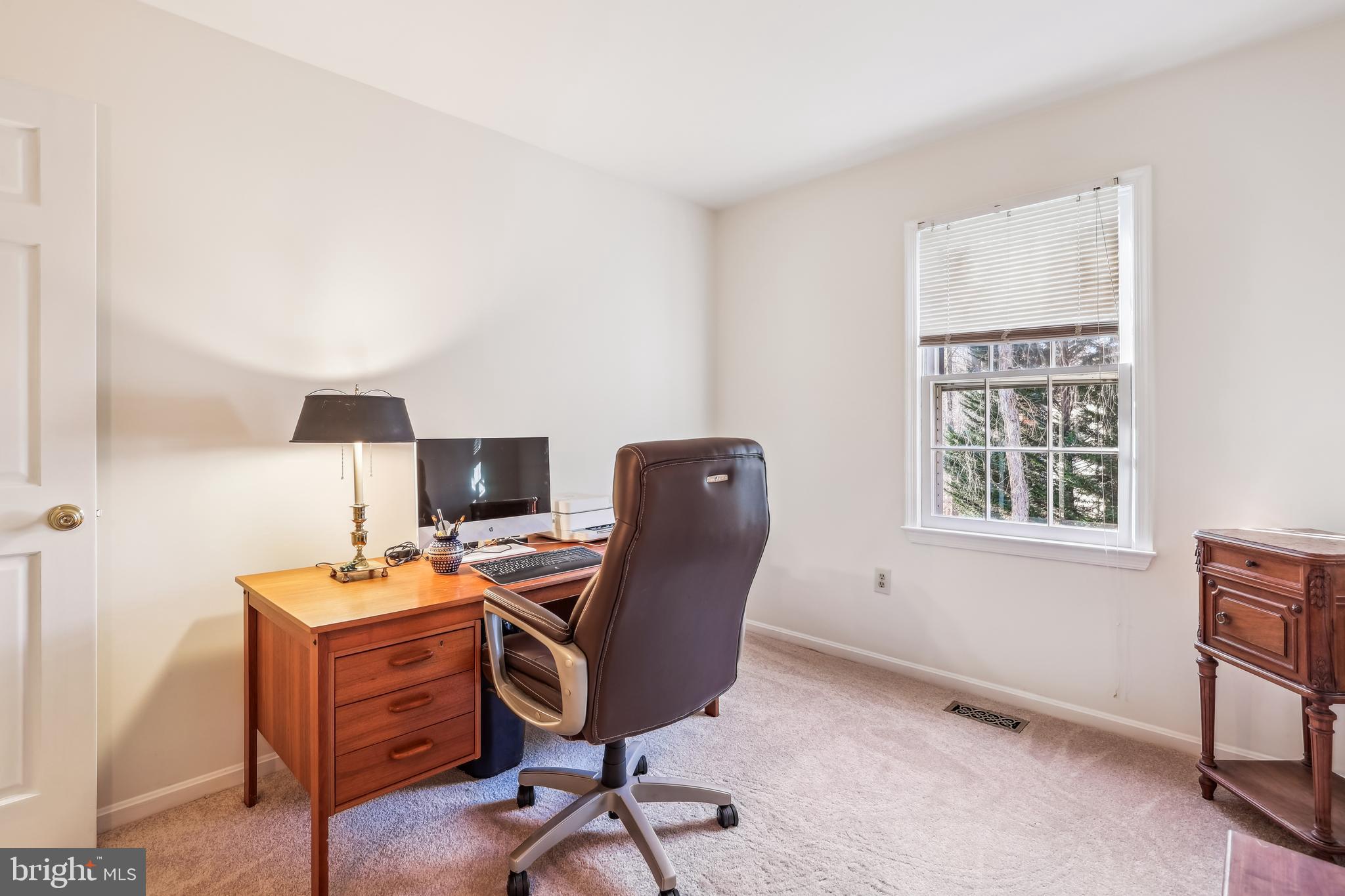 7122 Rolling Forest Avenue Springfield, VA 22152 - Photo 38 of 58 a view of a workspace with furniture and a window