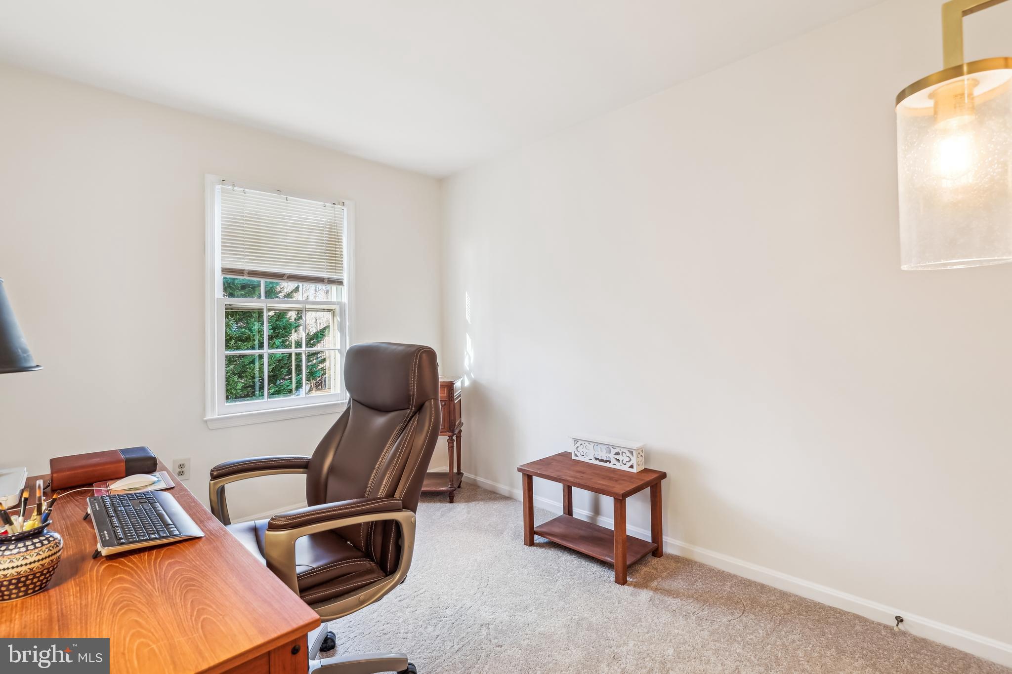 7122 Rolling Forest Avenue Springfield, VA 22152 - Photo 39 of 58 a view of a workspace with furniture and a window