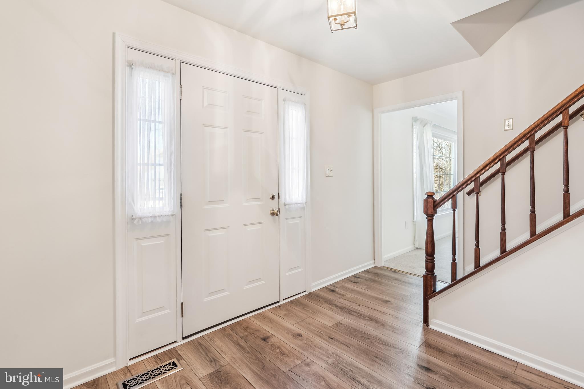 7122 Rolling Forest Avenue Springfield, VA 22152 - Photo 4 of 58 a view of an entryway with wooden floor