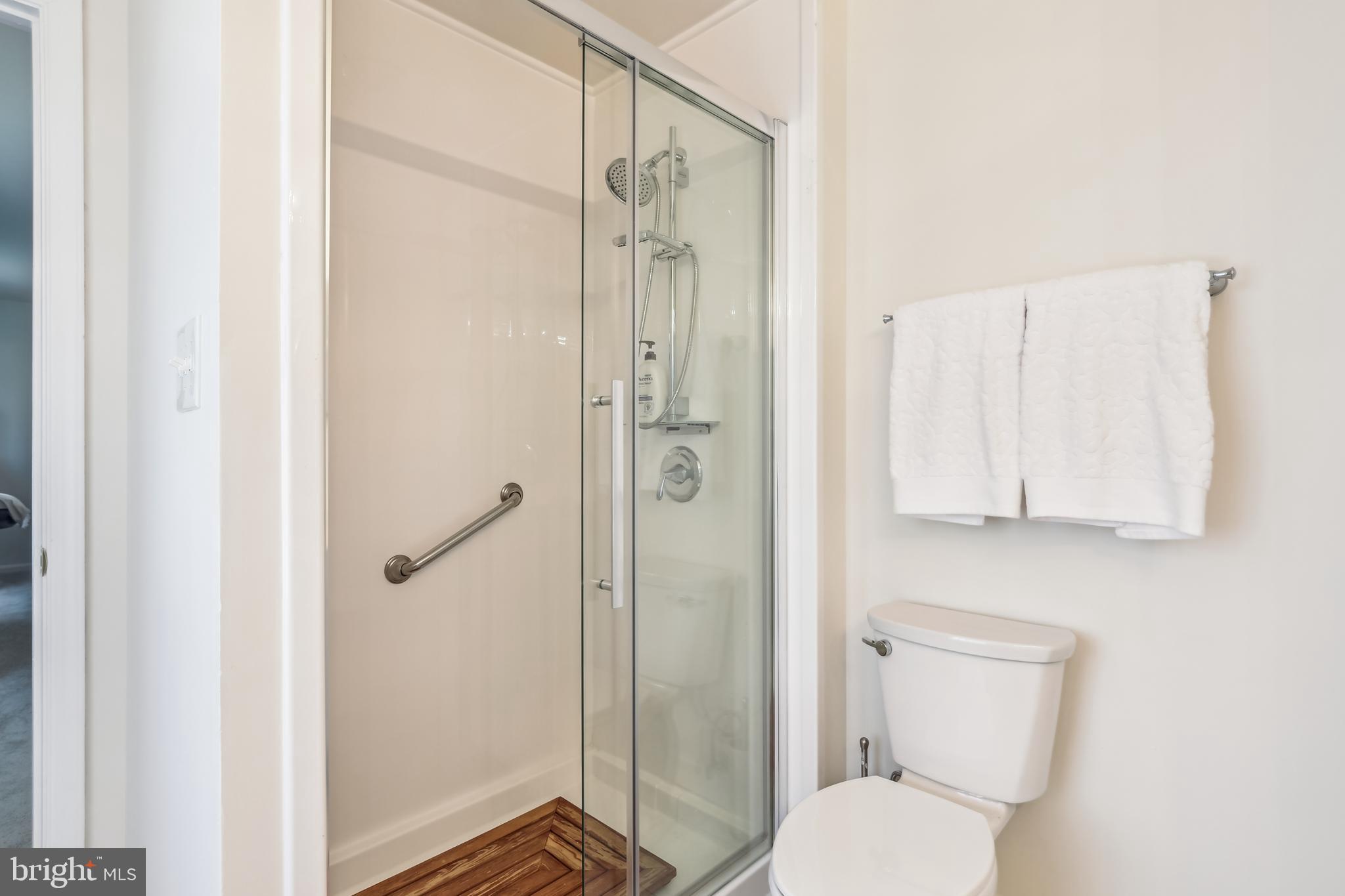 7122 Rolling Forest Avenue Springfield, VA 22152 - Photo 41 of 58 a bathroom with a toilet and a shower