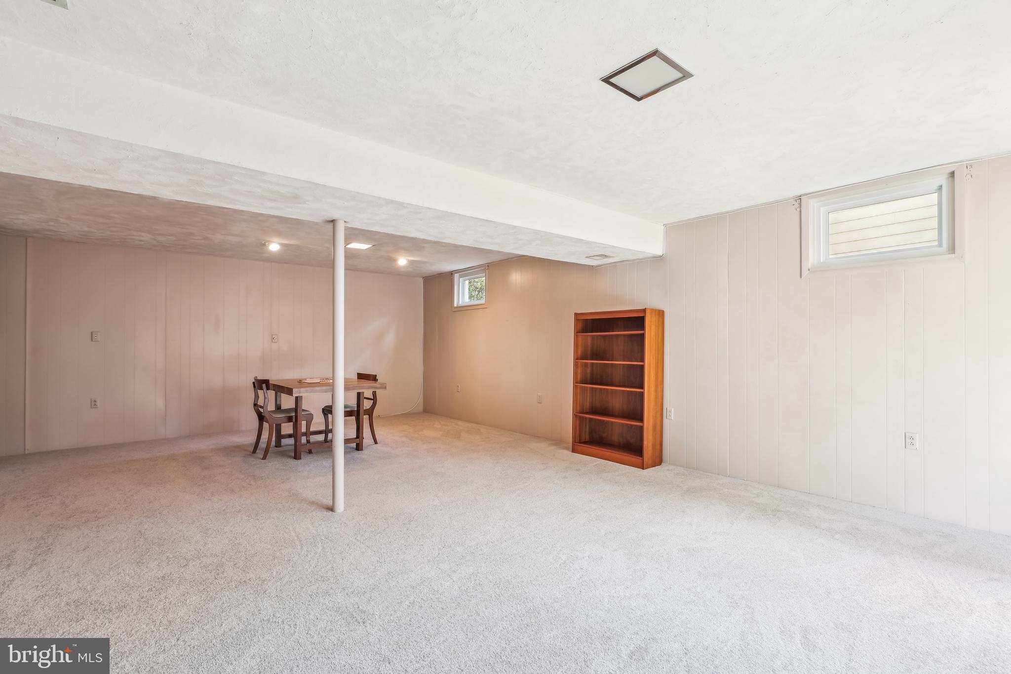 7122 Rolling Forest Avenue Springfield, VA 22152 - Photo 48 of 58 an empty room with furniture and a ceiling fan