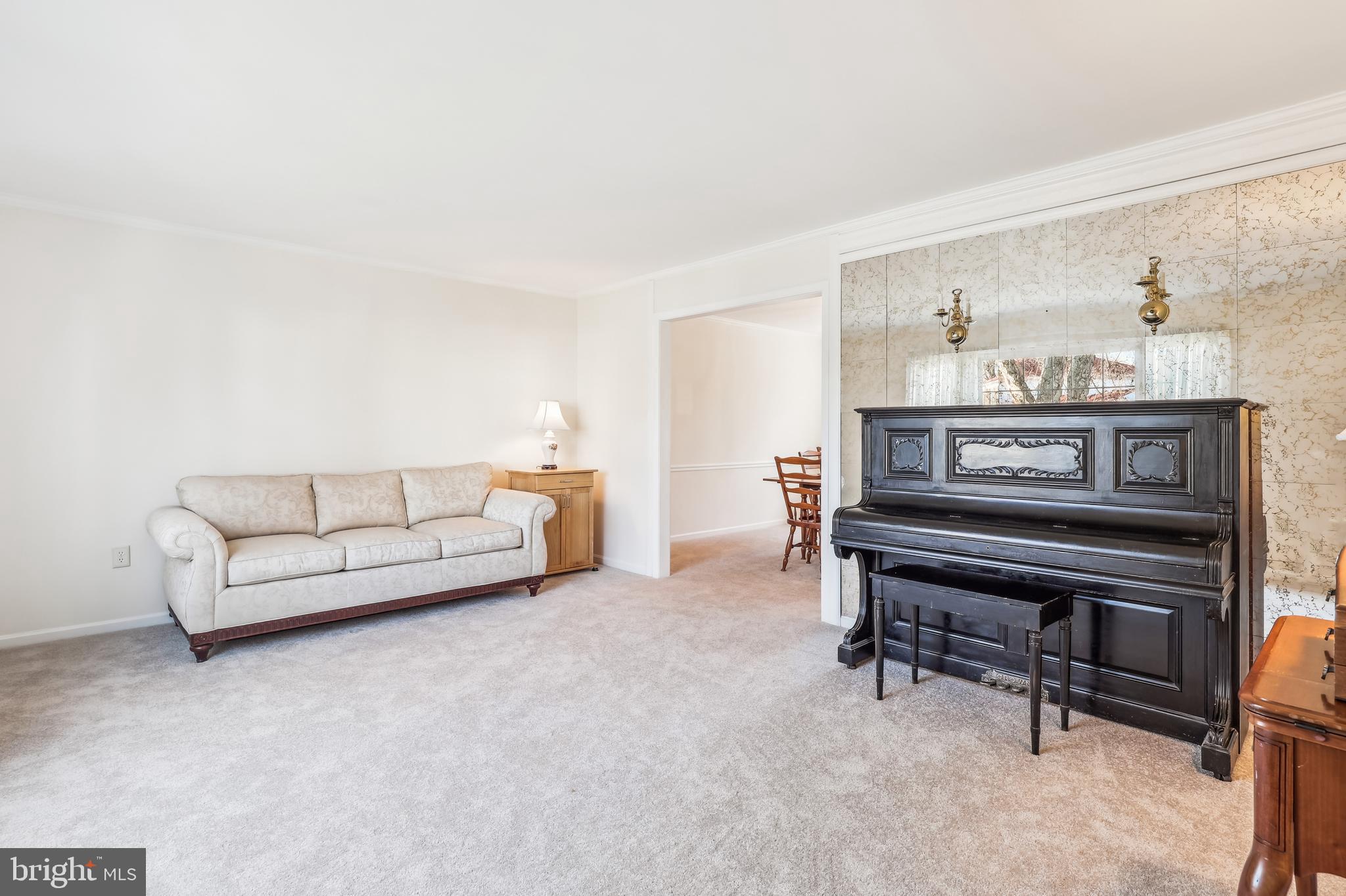 7122 Rolling Forest Avenue Springfield, VA 22152 - Photo 5 of 58 a living room with furniture and a piano