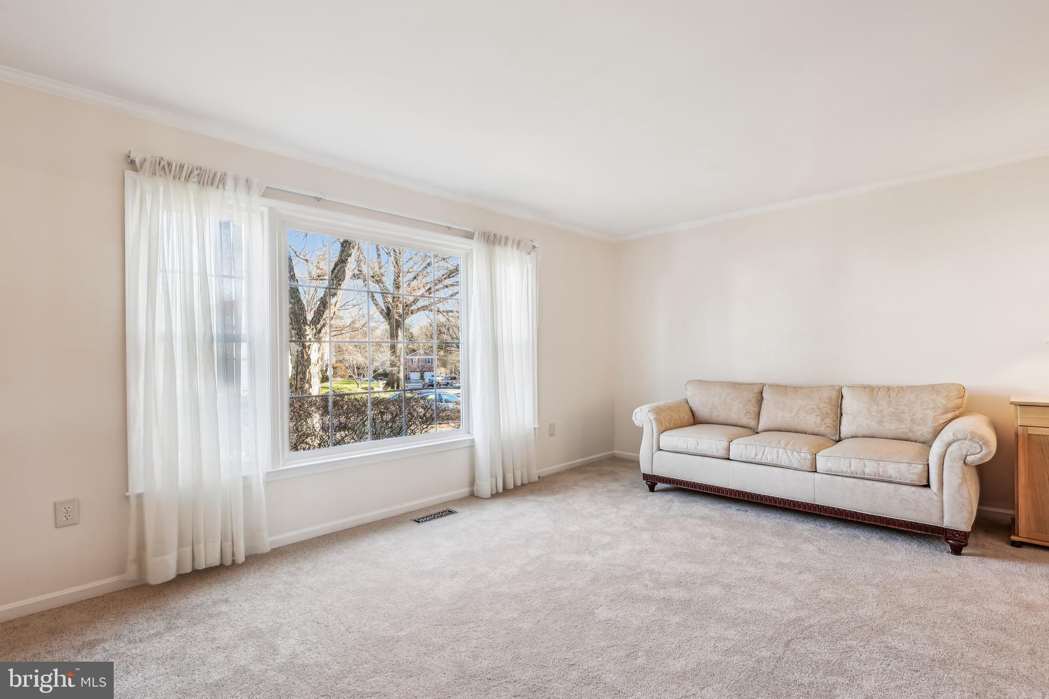 7122 Rolling Forest Avenue Springfield, VA 22152 - Photo 6 of 58 a living room with furniture and a large window