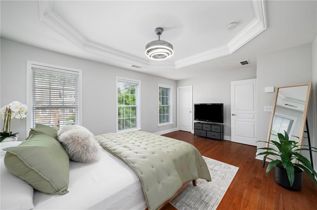 2872 Overlook Way Northeast Atlanta, GA 30324 - Photo 28 of 47 a bedroom with a bed and a flat screen tv