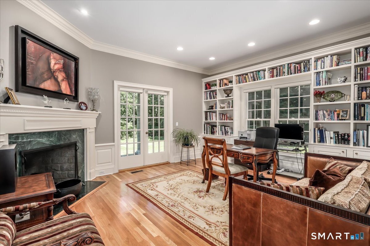 170 Branchville Road Ridgefield, CT 06877 - Photo 7 of 36 Library/Office with gas fireplace and french doors to patio