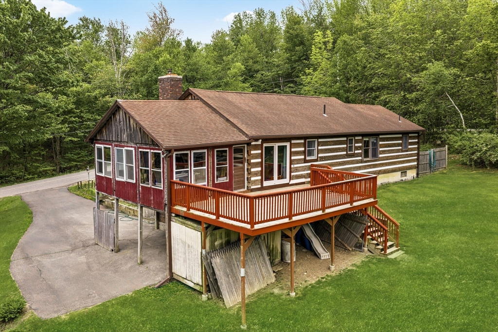 22 Lyon Hill Road Chester, MA 01011 - Photo 6 of 38 a aerial view of a house with a yard patio and deck