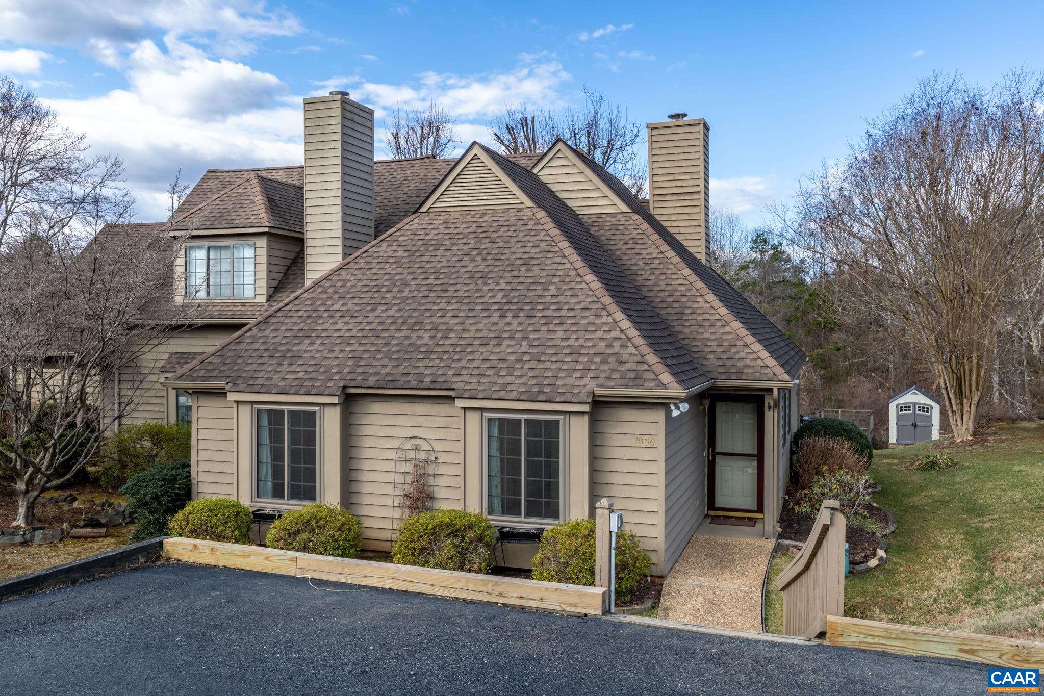 1006 Amber Ridge Road Charlottesville, VA 22901 - Photo 1 of 28 a front view of a house with garden