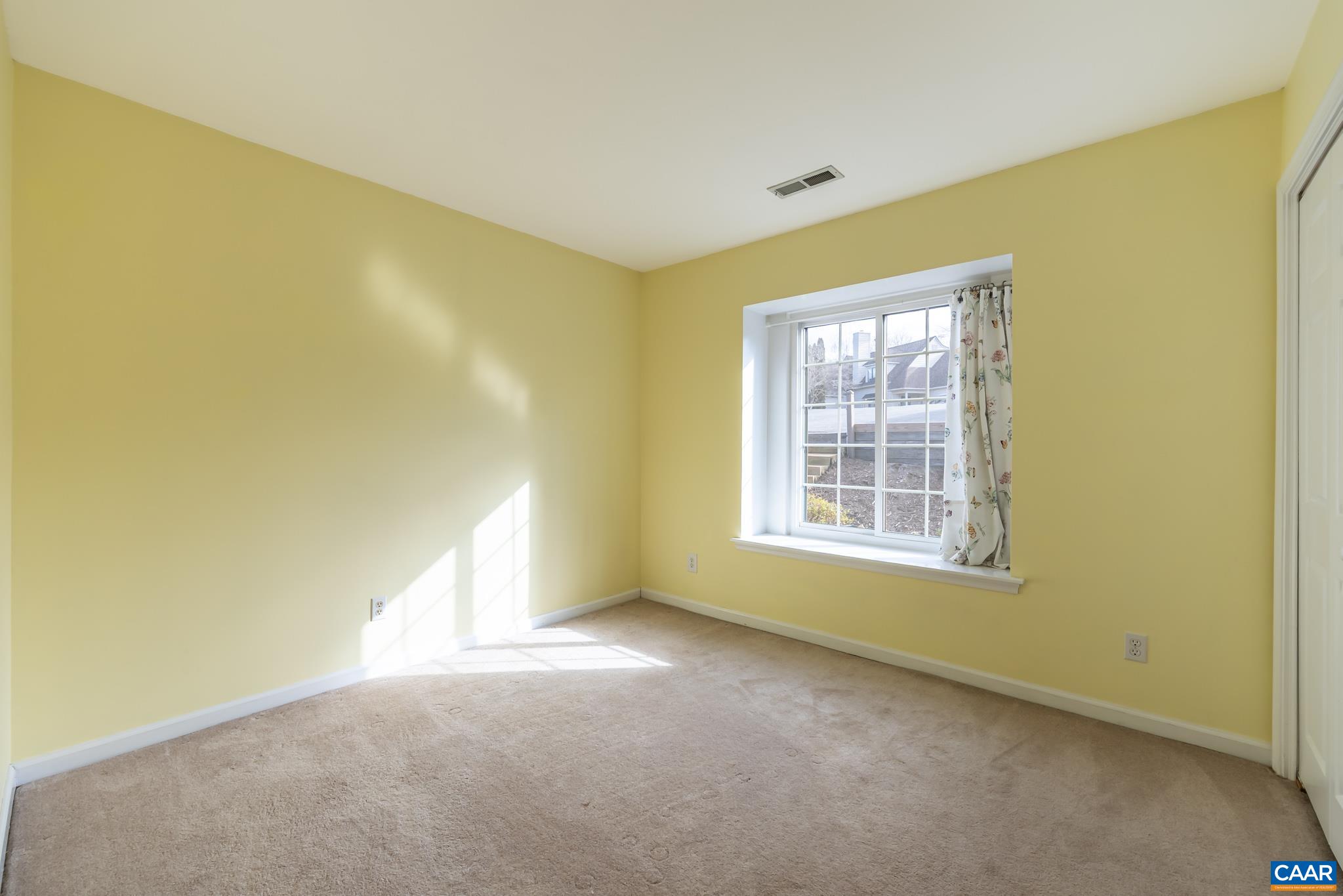 1006 Amber Ridge Road Charlottesville, VA 22901 - Photo 19 of 28 a view of an empty room with a window