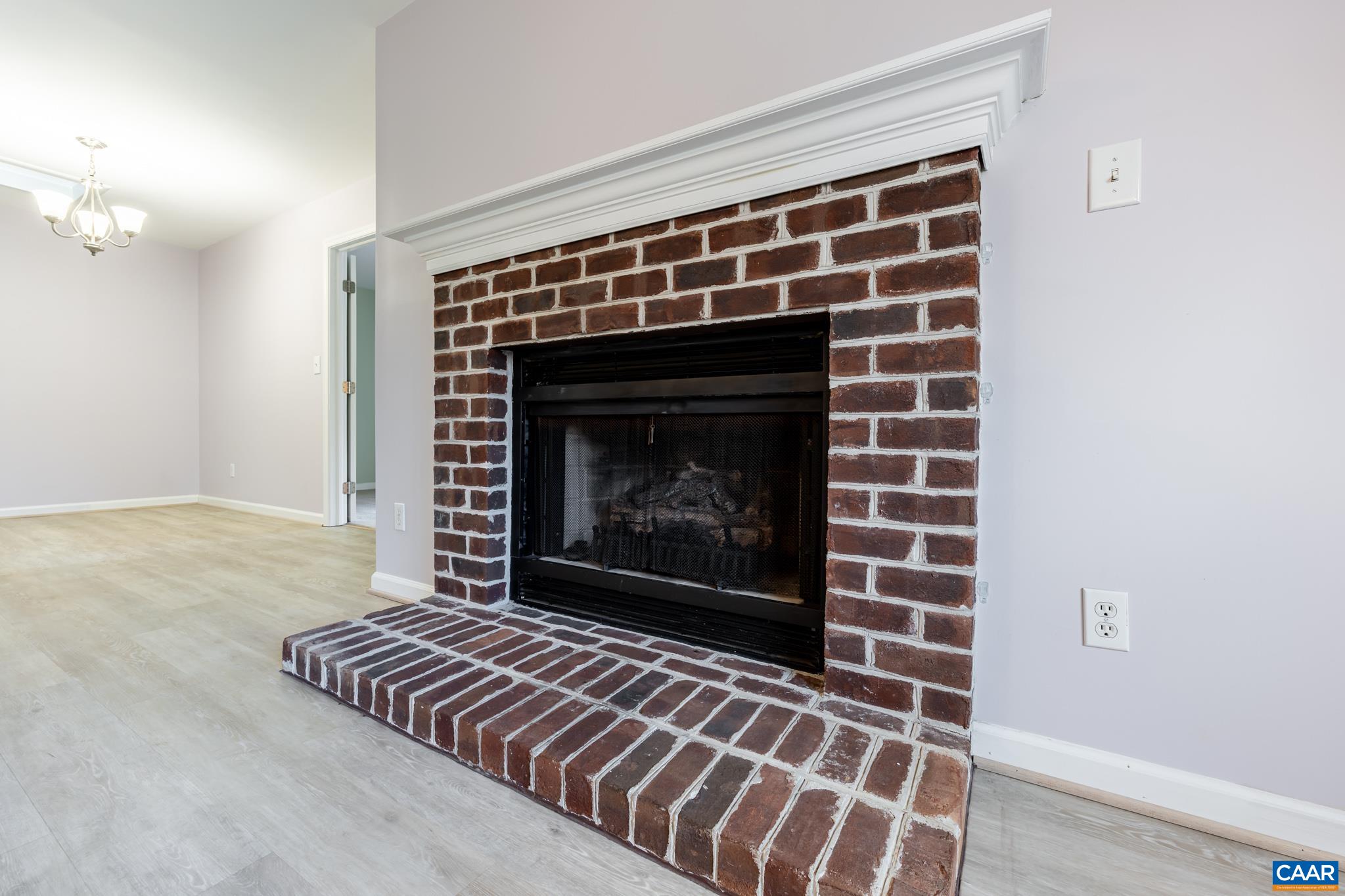1006 Amber Ridge Road Charlottesville, VA 22901 - Photo 6 of 28 a living room with furniture and a fireplace