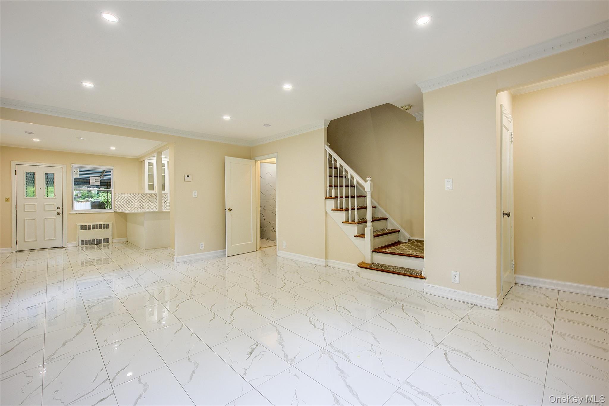 164-38 76th Road Queens, NY 11366 - Photo 4 of 44 a view of an entryway with a livingroom