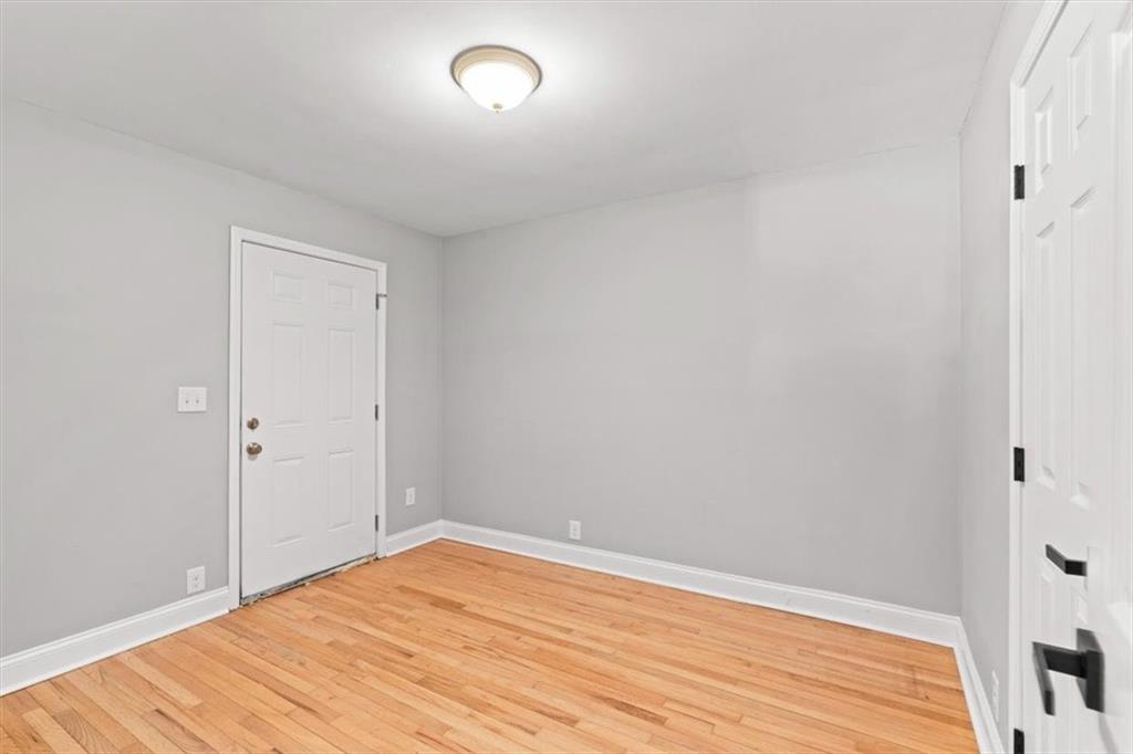 80 Hand Road Bowdon, GA 30108 - Photo 46 of 83 a view of empty room with wooden floor