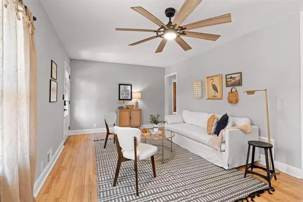 a living room with furniture and a window