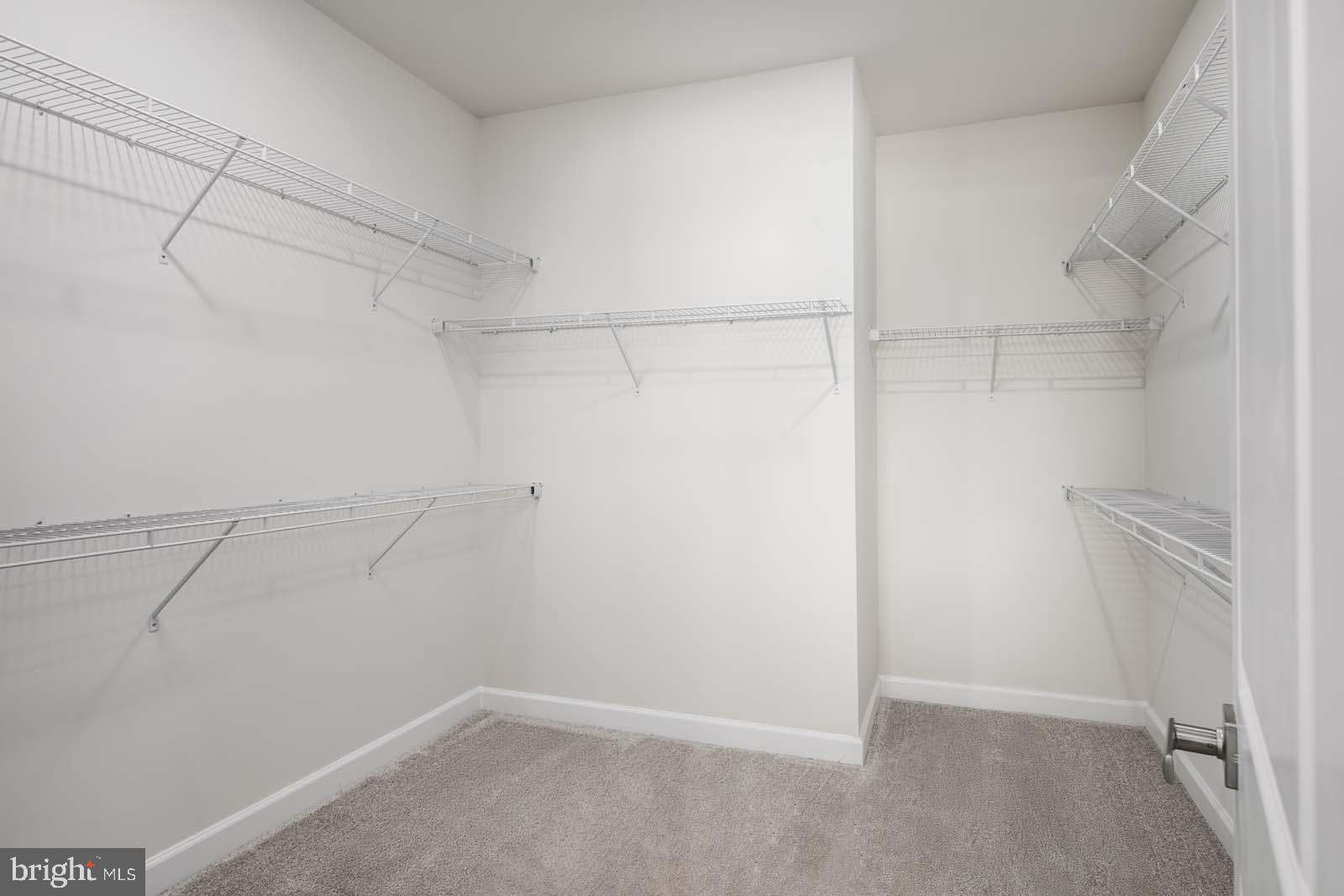 21825 Express Terrace, Unit 110 Ashburn, VA 20147 - Photo 13 of 20 a view of a room with racks on the wall