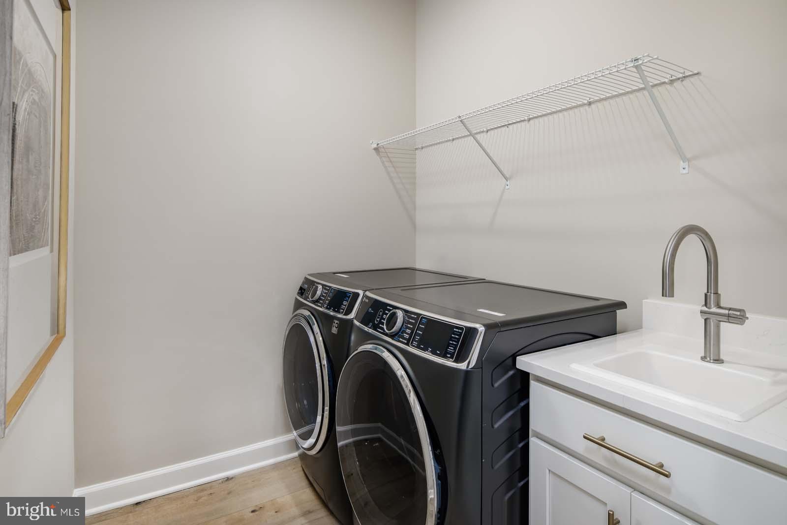 21825 Express Terrace, Unit 110 Ashburn, VA 20147 - Photo 20 of 20 a utility room with dryer and washer