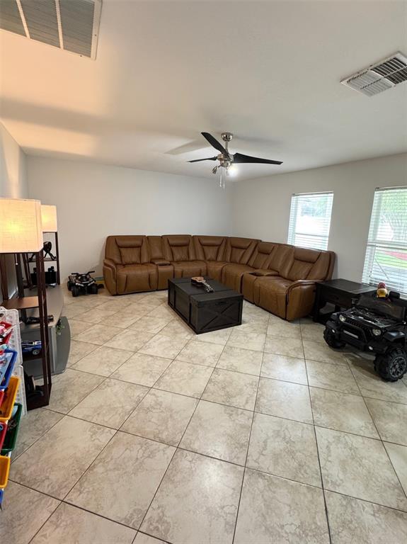 115 Willowbay Ridge Street Sanford, FL 32771 - Photo 11 of 28 a living room with furniture and a couch