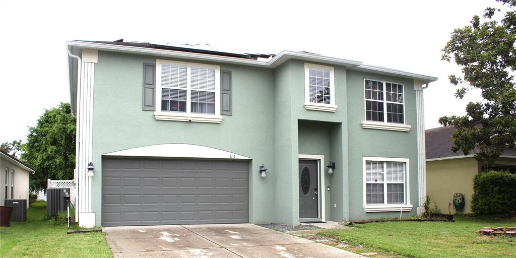 115 Willowbay Ridge Street Sanford, FL 32771 - Photo 2 of 28 a front view of a house with a yard