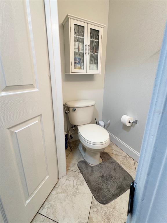 115 Willowbay Ridge Street Sanford, FL 32771 - Photo 24 of 28 a bathroom with a toilet and a sink