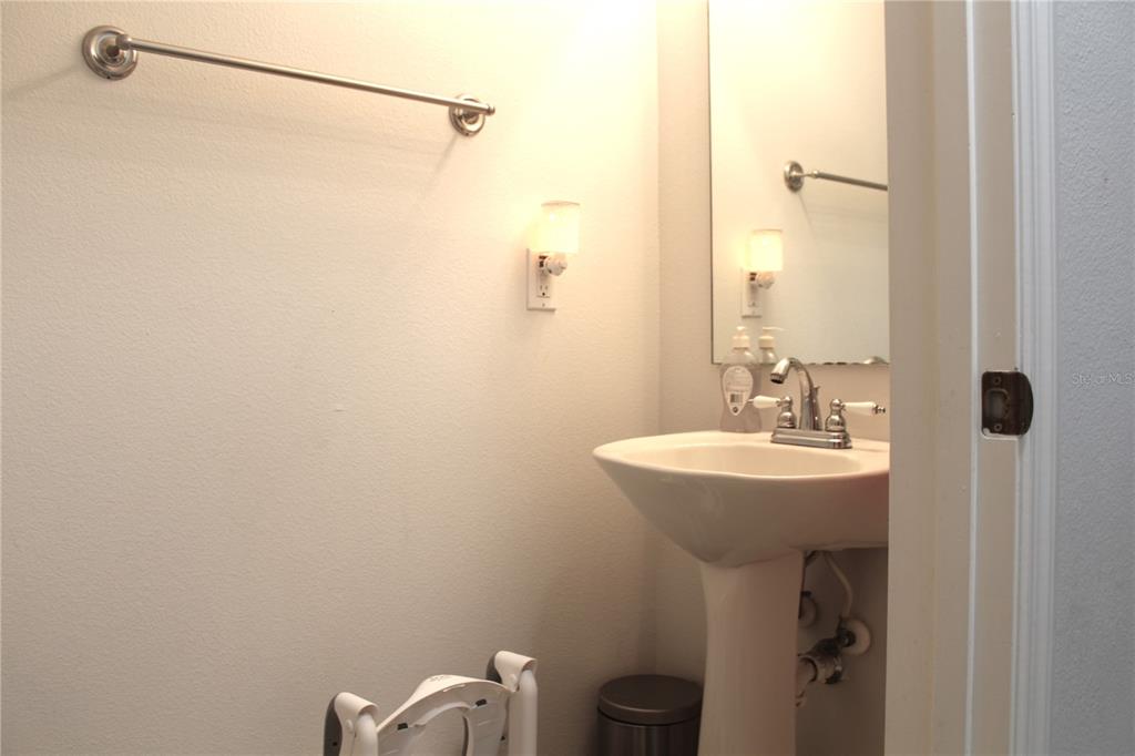 115 Willowbay Ridge Street Sanford, FL 32771 - Photo 25 of 28 a bathroom with a sink a toilet and shower