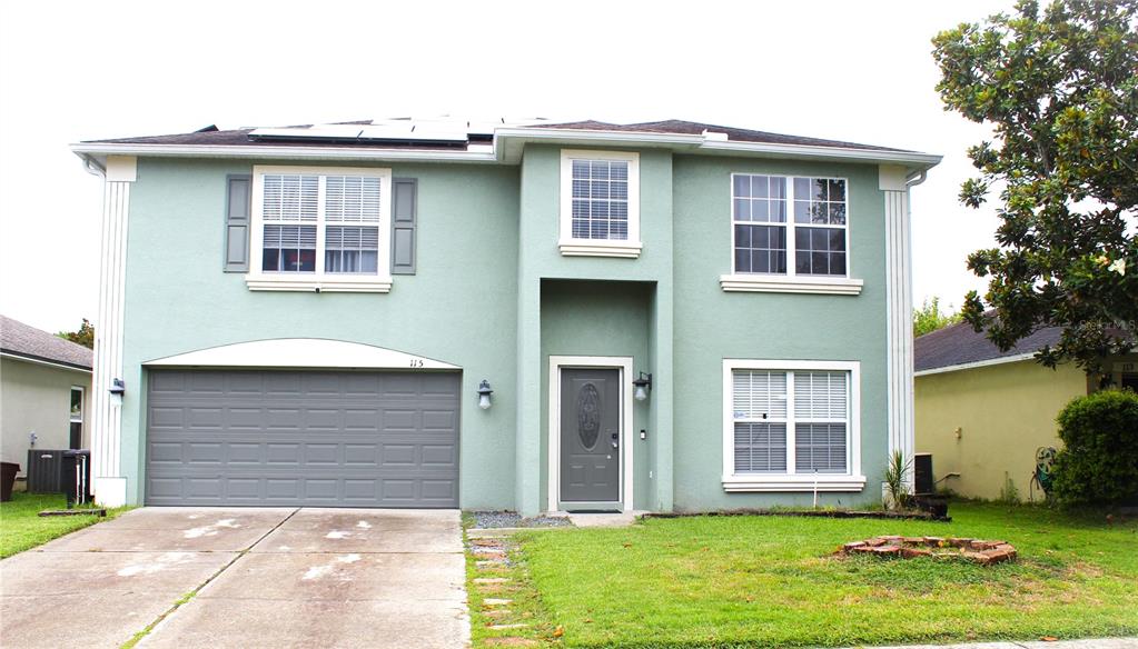 115 Willowbay Ridge Street Sanford, FL 32771 - Photo 3 of 28 a front view of a house with a yard