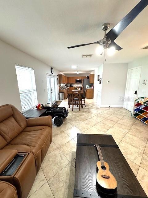 115 Willowbay Ridge Street Sanford, FL 32771 - Photo 9 of 28 a living room with furniture and a wooden floor