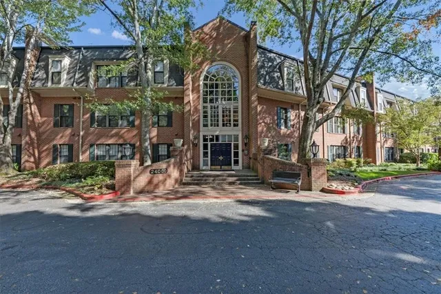 a view of a brick building with many windows