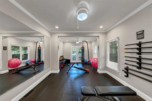 a living room with furniture and a book shelf
