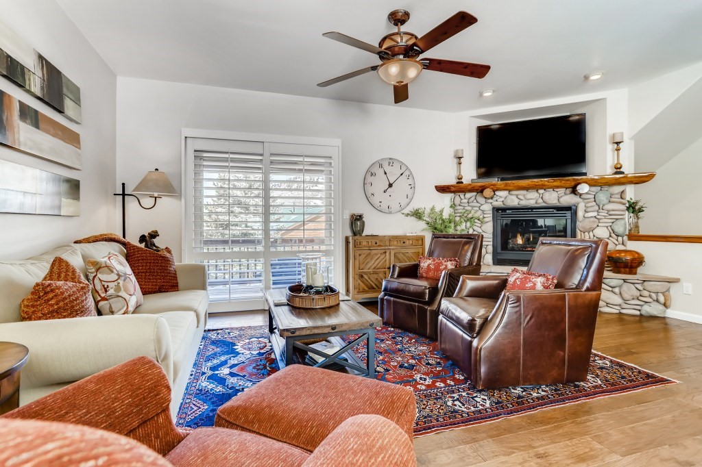 98 Lookout Ridge Drive, Unit 98 Dillon, CO 80435 - Photo 4 of 29 The LIVING ROOM has NEW wood flooring on the main floor along with NEW PELLA SLIDER DOORS with Plantation Shutters...