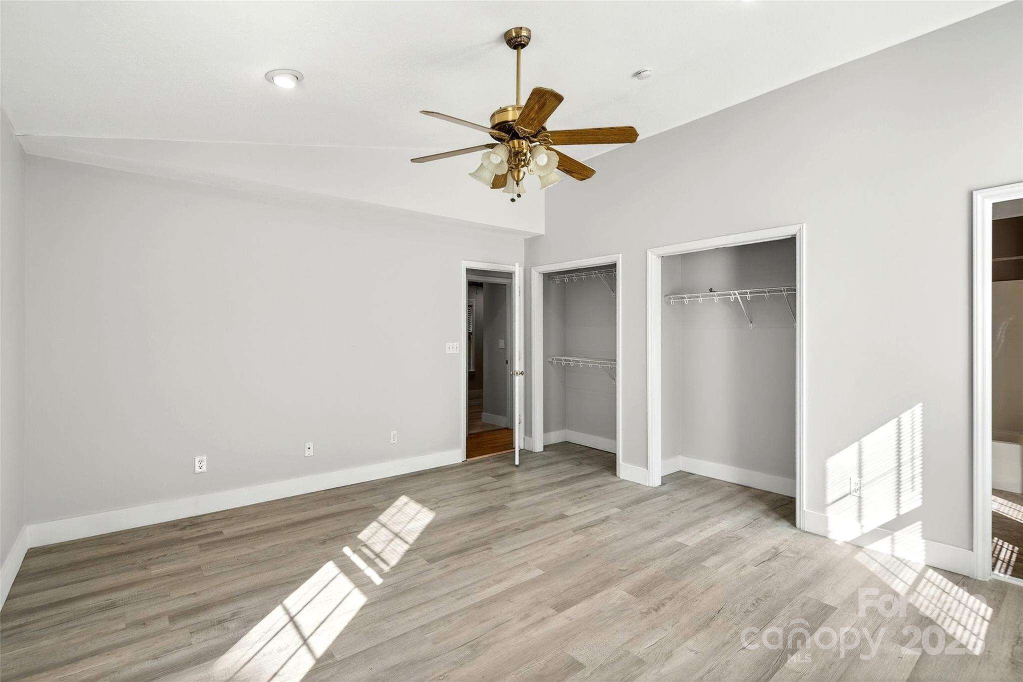 86 Springdale Drive Marion, NC 28752 - Photo 19 of 40 a view of a chandelier fan and wooden floor