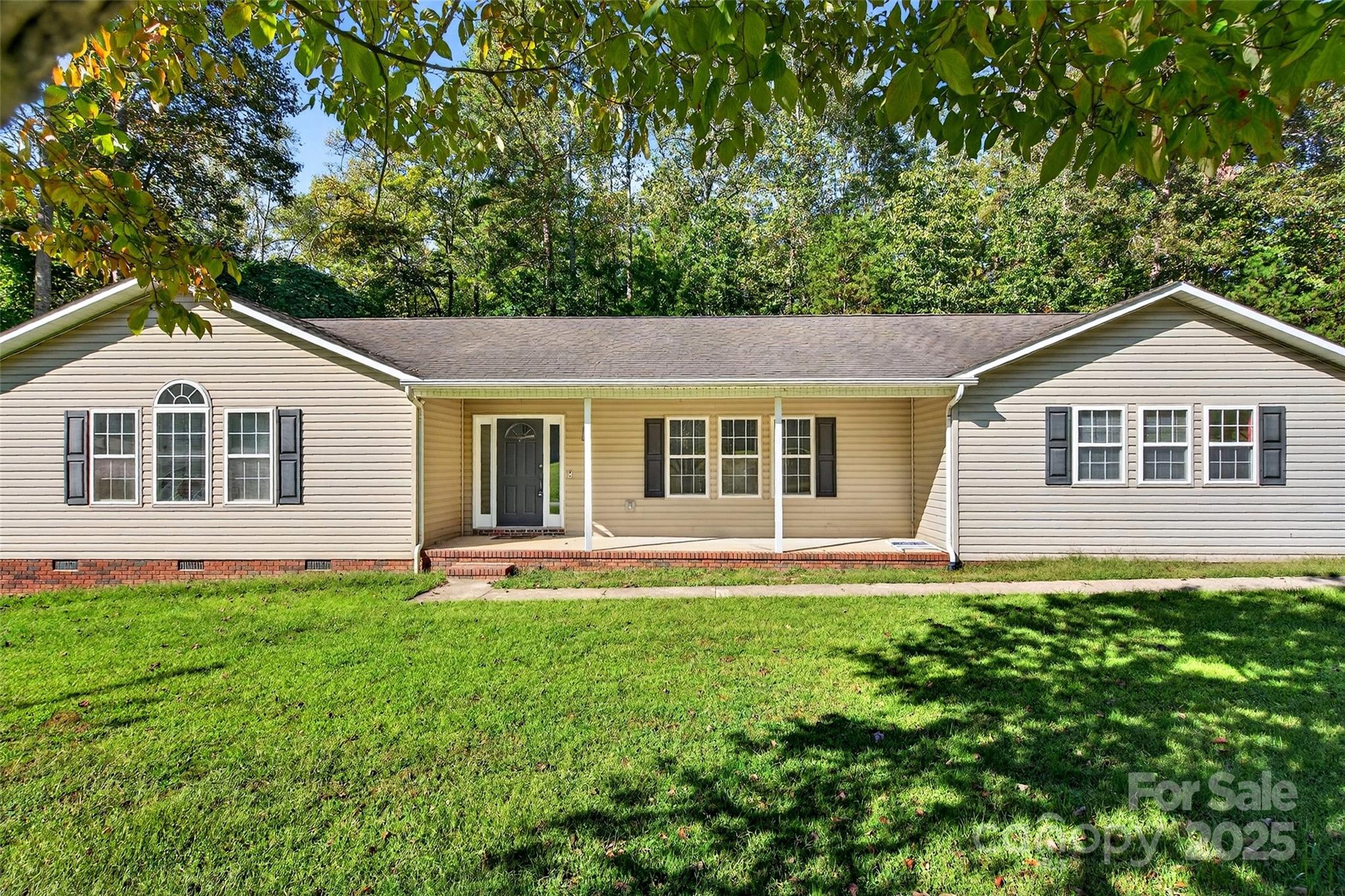 86 Springdale Drive Marion, NC 28752 - Photo 2 of 40 a front view of a house with a yard