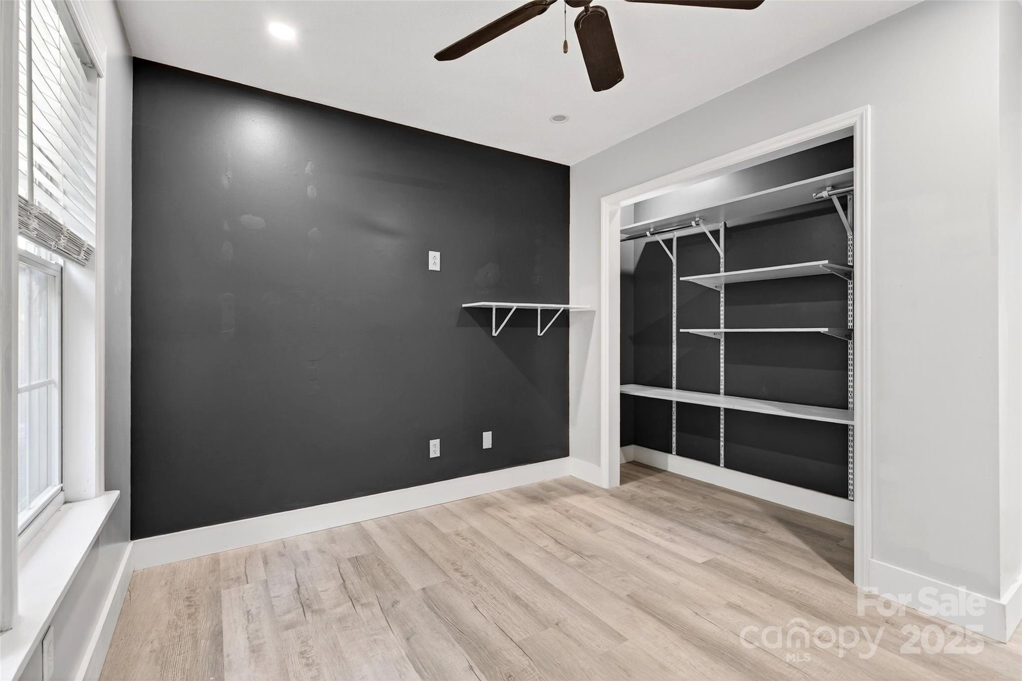 86 Springdale Drive Marion, NC 28752 - Photo 21 of 40 wooden floor and window in an empty room