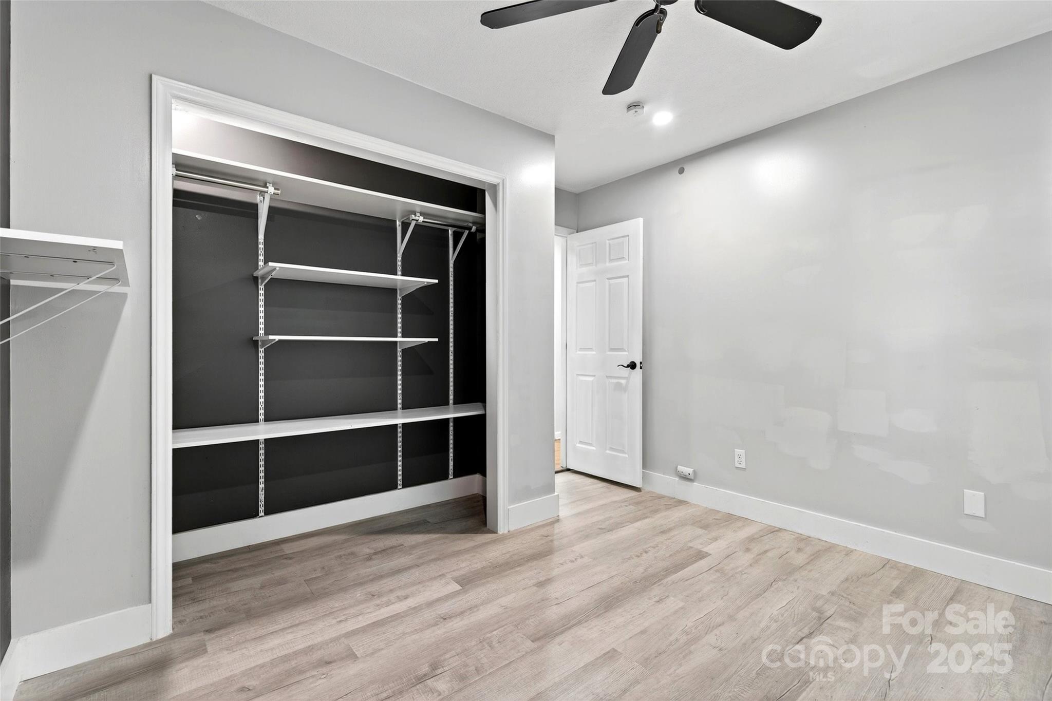 86 Springdale Drive Marion, NC 28752 - Photo 23 of 40 a view of an empty room with a window and wooden floor
