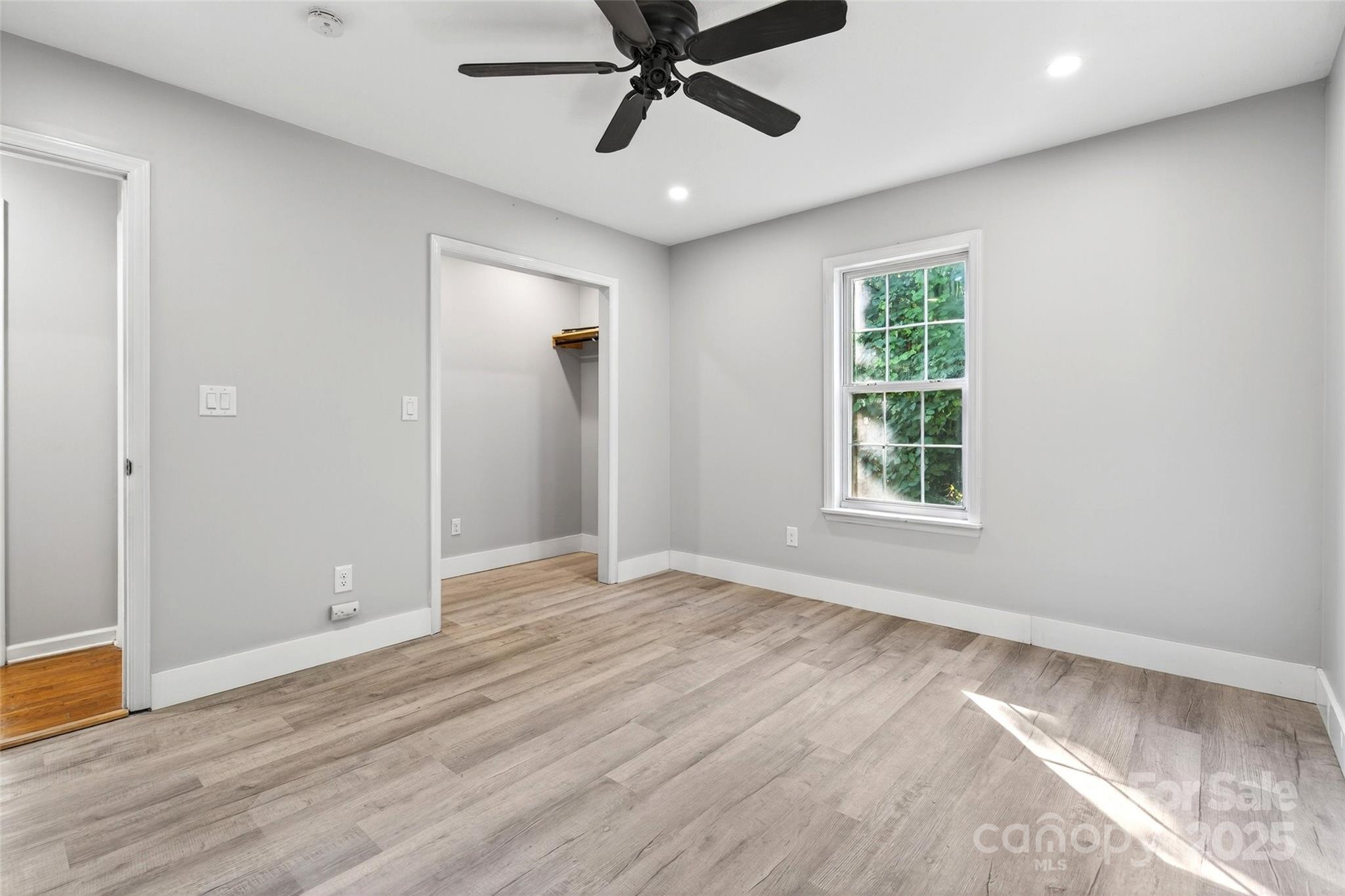 86 Springdale Drive Marion, NC 28752 - Photo 26 of 40 wooden floor in an empty room with a window